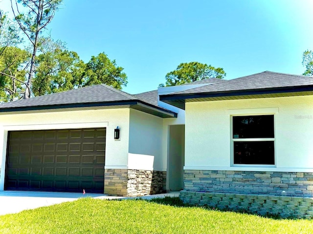 view of side of property with a yard and a garage