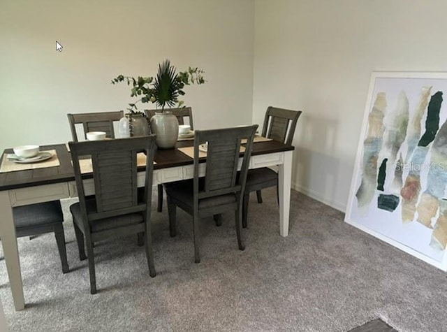 dining area with carpet