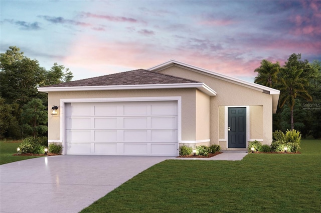 ranch-style house featuring a garage and a lawn