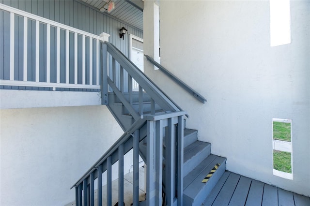 stairway with wood-type flooring