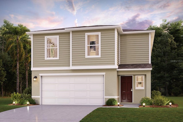 view of front facade with a lawn and a garage