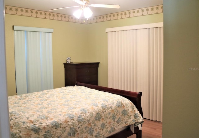 bedroom featuring ceiling fan and light wood-type flooring