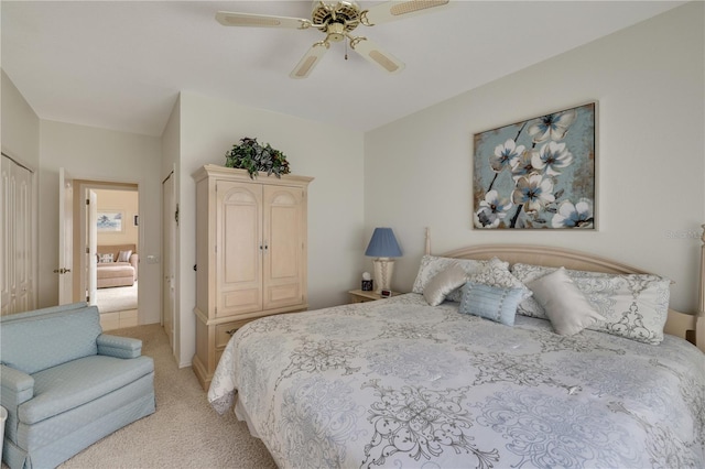 bedroom featuring light carpet and ceiling fan