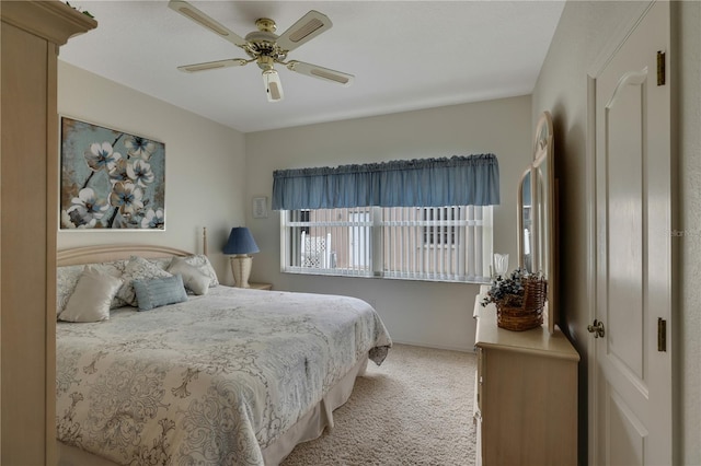 bedroom featuring ceiling fan and light carpet