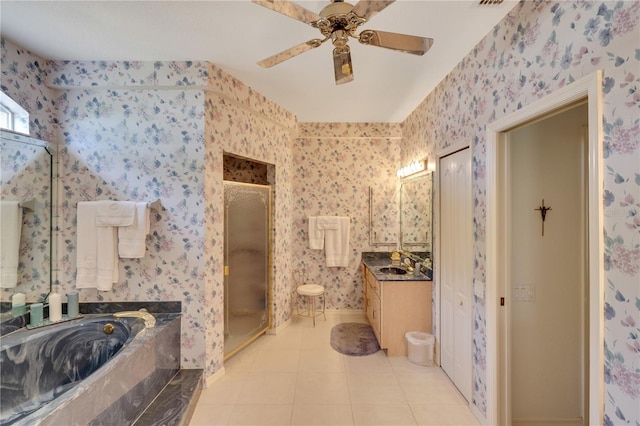 bathroom with tile patterned floors, ceiling fan, vanity, and independent shower and bath