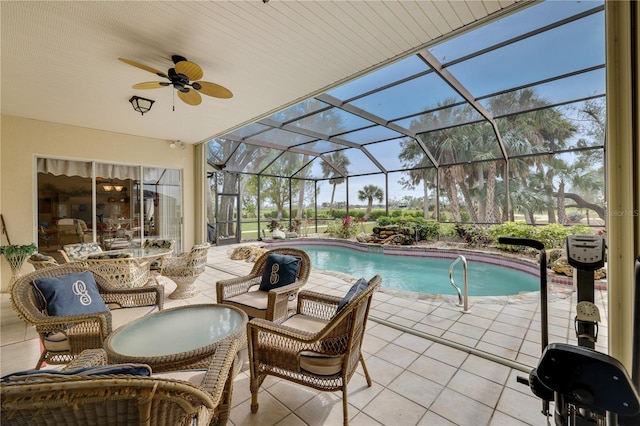 view of swimming pool with a patio, glass enclosure, and ceiling fan