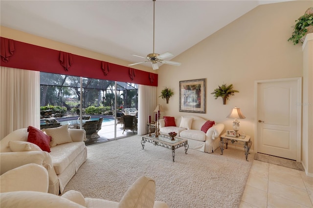 tiled living room featuring ceiling fan and high vaulted ceiling