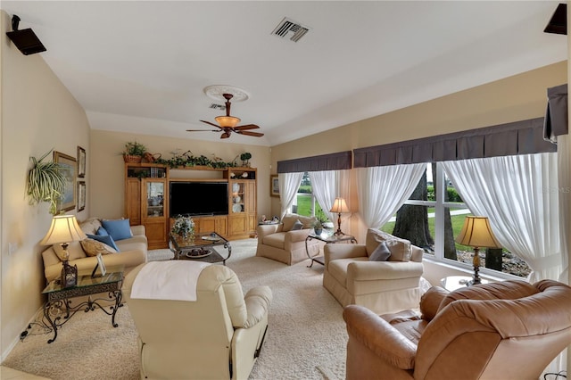 carpeted living room featuring ceiling fan