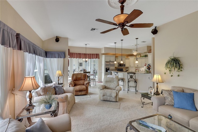 living room with light carpet, vaulted ceiling, and ceiling fan