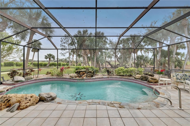 view of pool featuring a patio area and a lanai