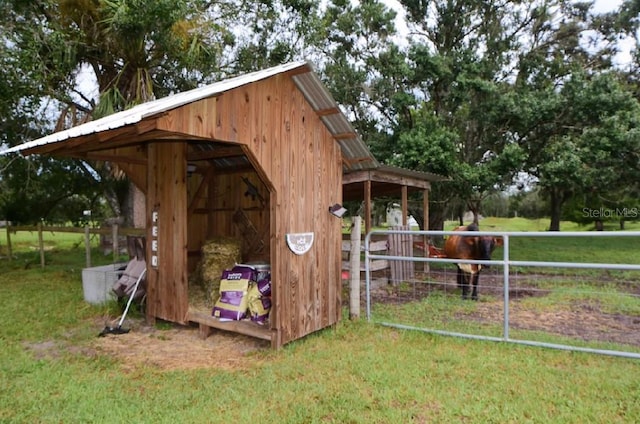 view of outbuilding featuring a lawn