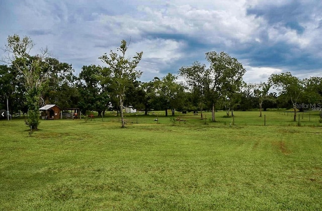 view of yard with a rural view