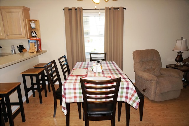 dining space featuring light wood-type flooring