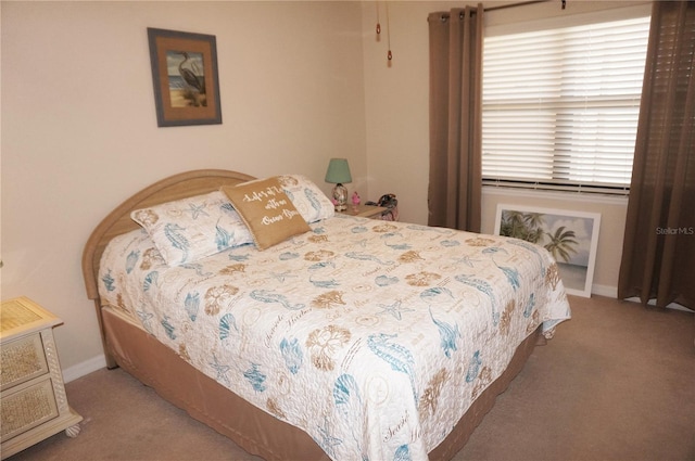 bedroom with carpet floors and multiple windows