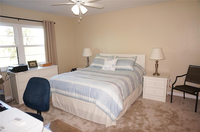 bedroom with light colored carpet and ceiling fan