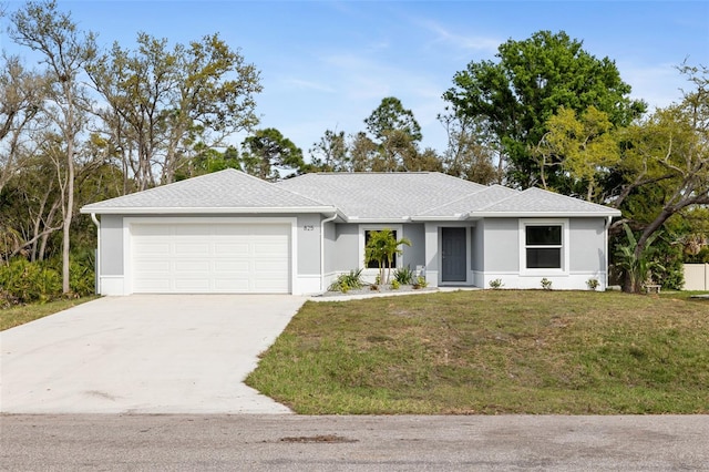 ranch-style home with a garage and a front yard