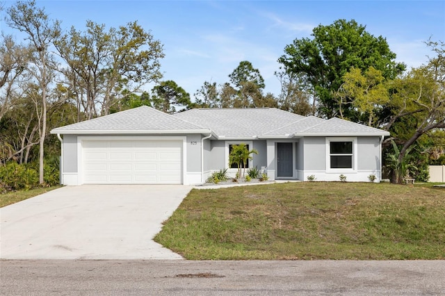 ranch-style home featuring a garage and a front lawn