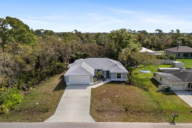 view of front facade with a garage and a front yard