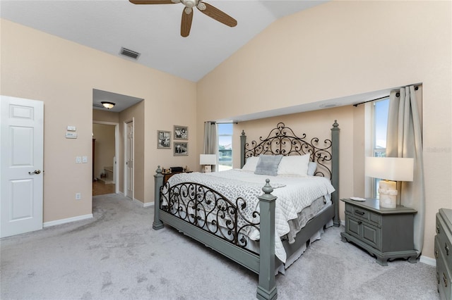 carpeted bedroom with ceiling fan and lofted ceiling