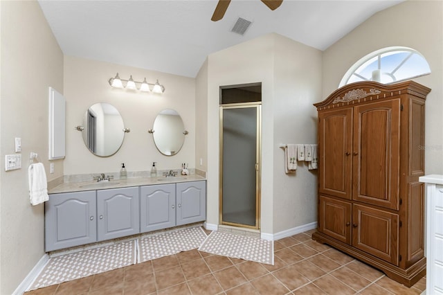 bathroom featuring tile patterned floors, ceiling fan, and an enclosed shower