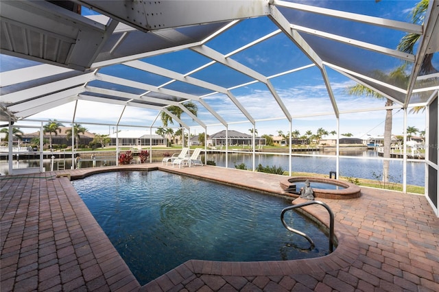 view of pool featuring a patio, a water view, and glass enclosure