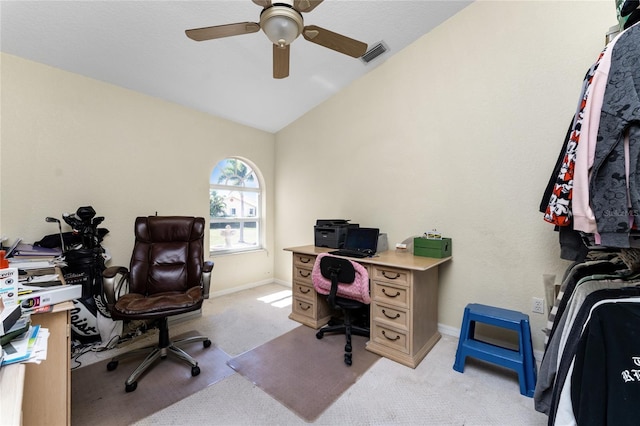 carpeted office space with ceiling fan and lofted ceiling