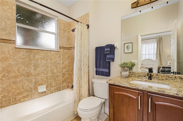 full bathroom with toilet, shower / bath combo with shower curtain, and vanity