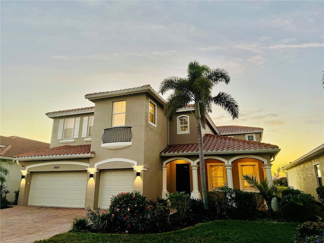 mediterranean / spanish-style house featuring a garage