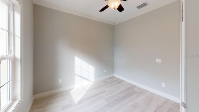 unfurnished room with crown molding, ceiling fan, and light wood-type flooring