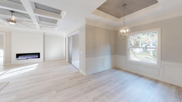 unfurnished dining area featuring beamed ceiling, ornamental molding, coffered ceiling, and light hardwood / wood-style flooring