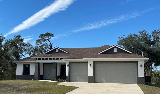 view of front facade with a garage, a front lawn, and central air condition unit