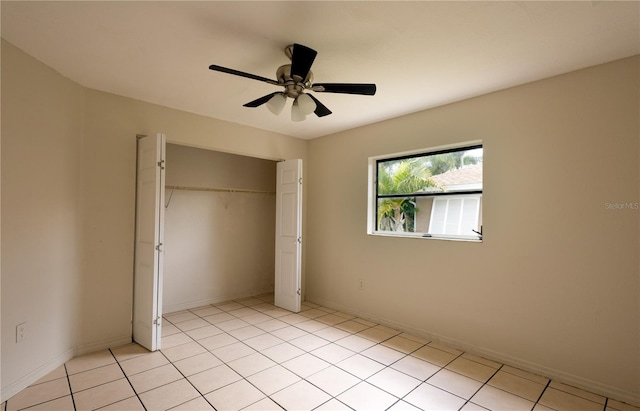 unfurnished bedroom featuring light tile patterned flooring, ceiling fan, and a closet