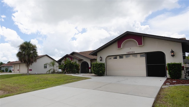 view of front facade featuring a front lawn and a garage