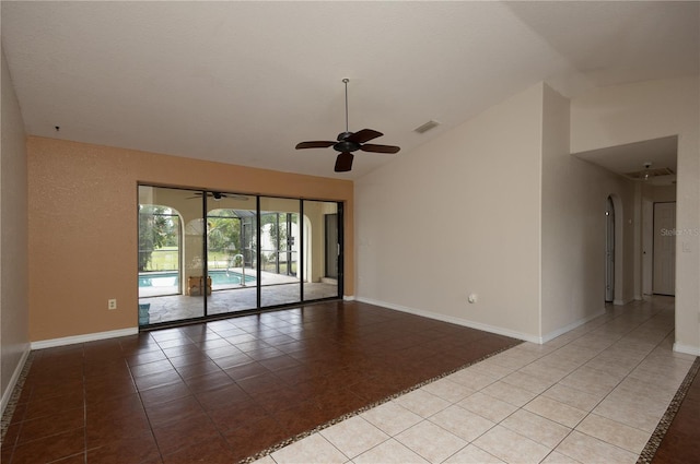 unfurnished room with ceiling fan, light tile patterned floors, and high vaulted ceiling