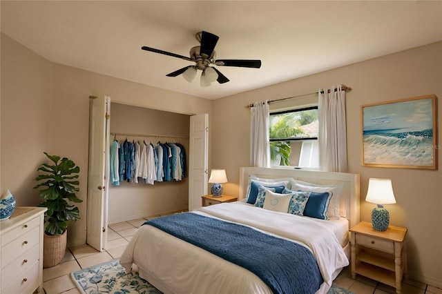 tiled bedroom featuring a closet and ceiling fan