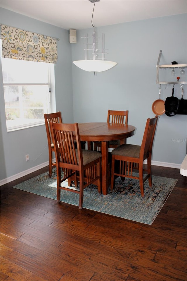 dining area featuring dark hardwood / wood-style floors