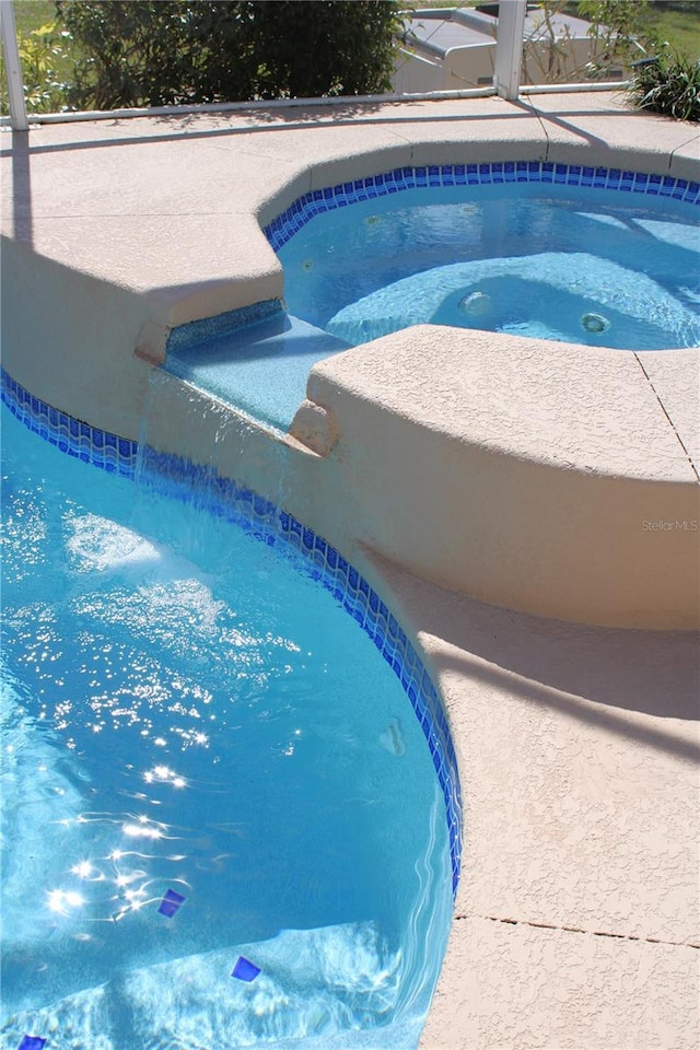 view of pool featuring a lanai