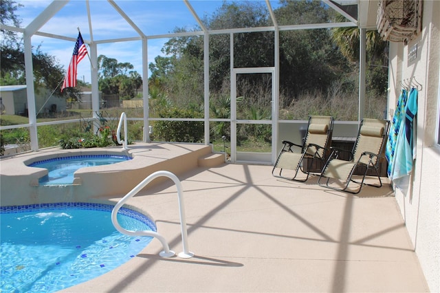 view of swimming pool featuring a patio area and glass enclosure