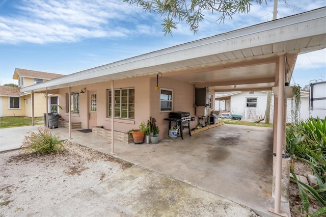 exterior space featuring a carport