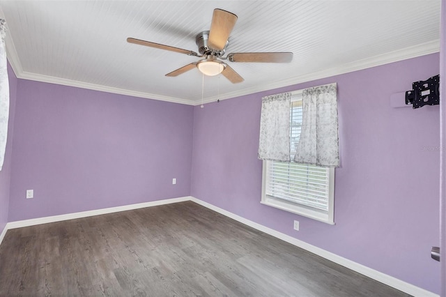 empty room featuring crown molding, ceiling fan, and dark wood-type flooring