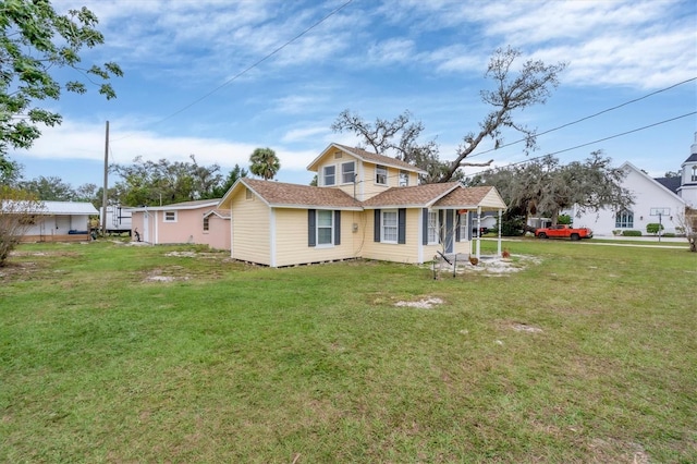 back of house with a yard