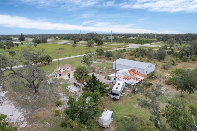 birds eye view of property featuring a rural view