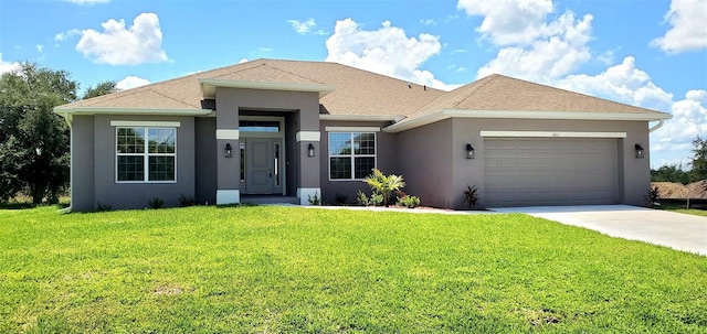 view of front of house featuring a garage and a front yard