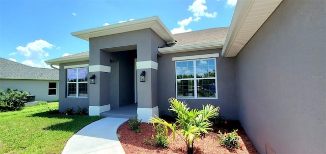 property entrance featuring a yard