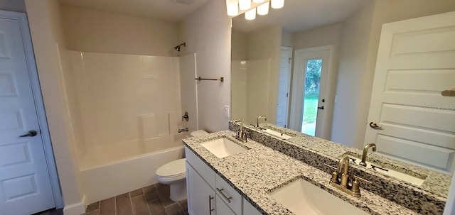 full bathroom featuring vanity, toilet, and shower / bathtub combination