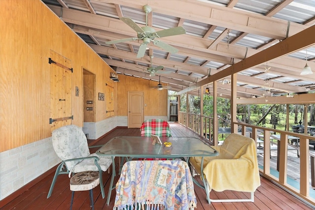 sunroom / solarium with lofted ceiling with beams