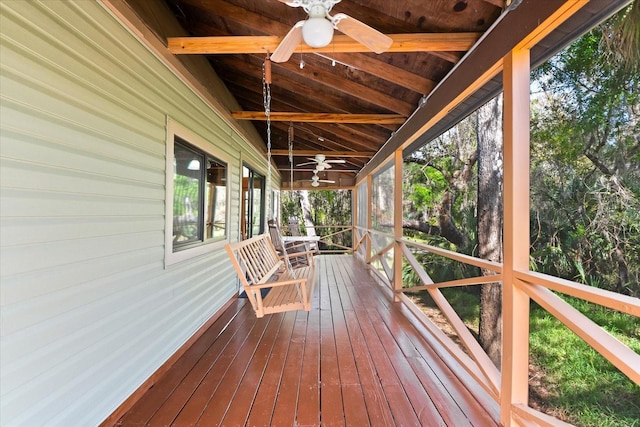 wooden deck featuring ceiling fan