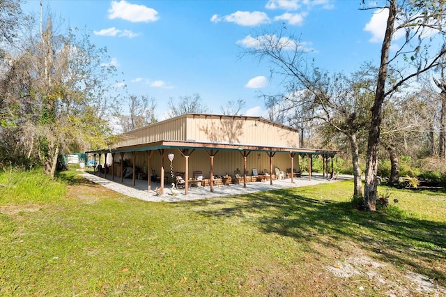 rear view of house with a lawn