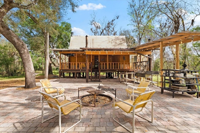 view of patio featuring a sunroom