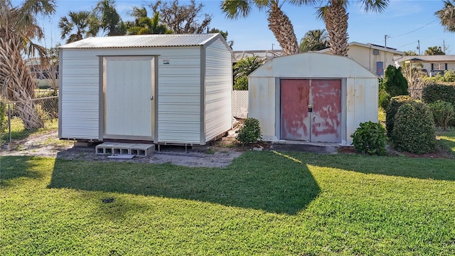 view of shed / structure with a yard